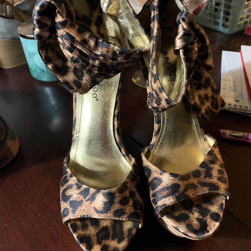 Bamboo. Zip up cheetah print wedge heel boots. Size 7.